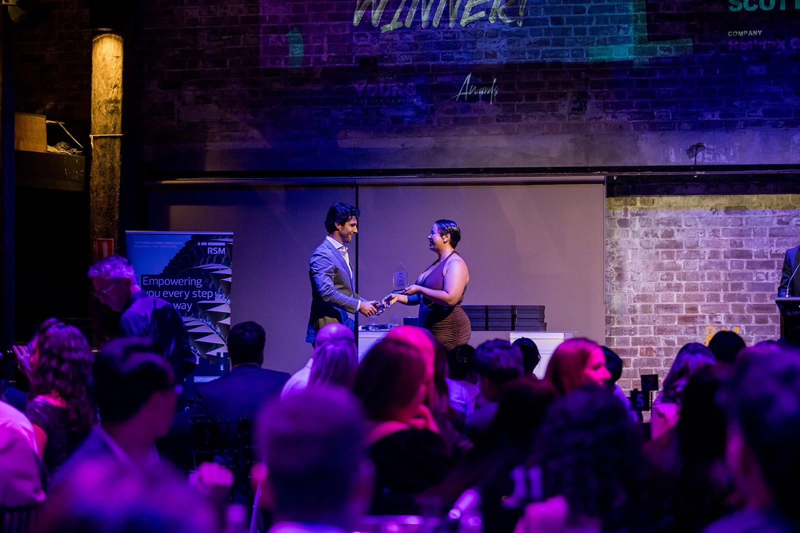 2025 Sydney Young Entrepreneur Awards Gala Dinner Winners accepting trophies on stage at the 2025 Sydney Young Entrepreneur Awards